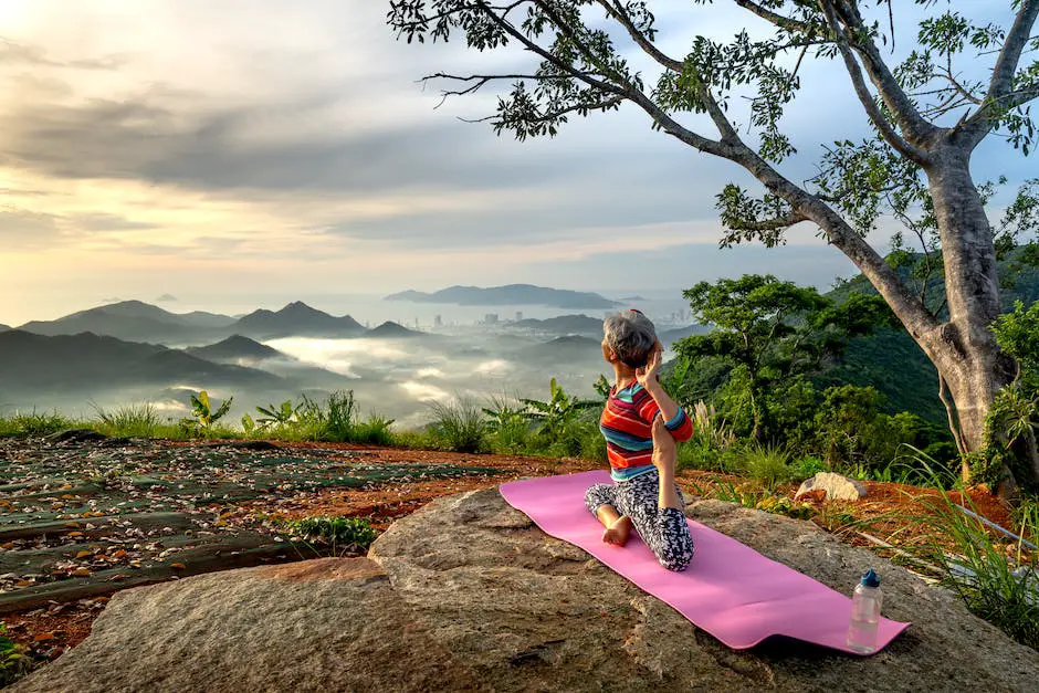 A person meditating in front of a mountain